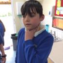 Willow class pupil taking their pulse rate after exercise