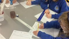 Children writing up their science experiments