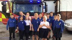 Willow pose in front of the fire engine