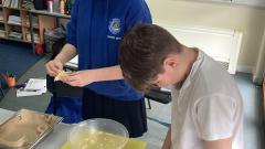 Pupils preparing and mixing ingredients