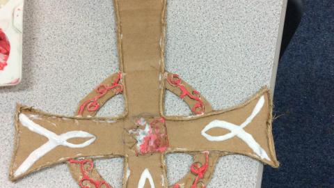 A willow class pupil using ova glue to create a raised pattern 