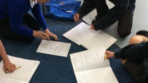 Willow class pupils completing their healthy hearts experiment work sheets