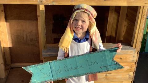 Child dressed as innkeeper 