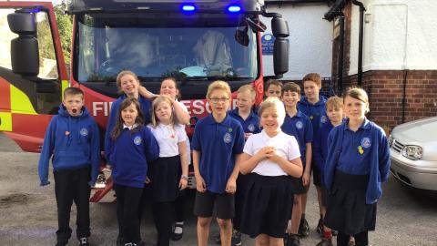 Willow pose in front of the fire engine