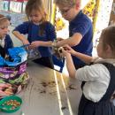 Children planting seeds in zip lock bags