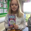 Willow class pupil holding the dork diaries