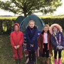 Group 2 outside the den they built.