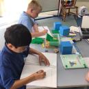 Children using practical equipment in maths to help with their learning