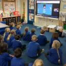 Children looking at the smartboard