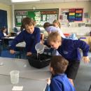 Pouring liquid to measure and compare