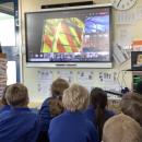Children looking how the ramp of an ambulance works