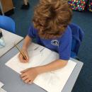 Using our sketching skills to create pencil drawings of Mayan masks