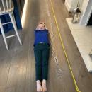 Boy next to paper chain and measuring tape