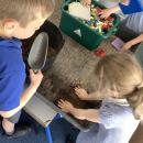 Children building a mud house