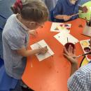 Children printing with shapes and paint