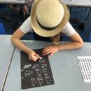 The children experiencing what it would have been like to write with chalk!