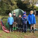 Group 1 outside the den they built.