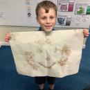 A picture created using mud. 