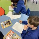 Children researching about penguins