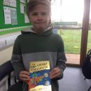 Willow class pupil holding the 130 storey tree house