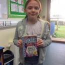 Willow class pupil holding the dork diaries