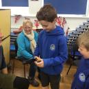 A child holding a wooden truncheon