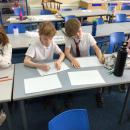 Sebby and Jasper creating snowflakes in the factory