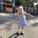 Child playing with a hoopla hoop