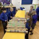 Year 2 children selling our wrapping paper