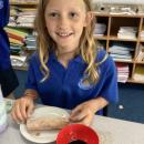 Pupil with their baked spring roll and dipping sauce