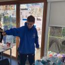 Year 6 pupils open their hoodies