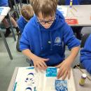 Placing their template in their sketch book